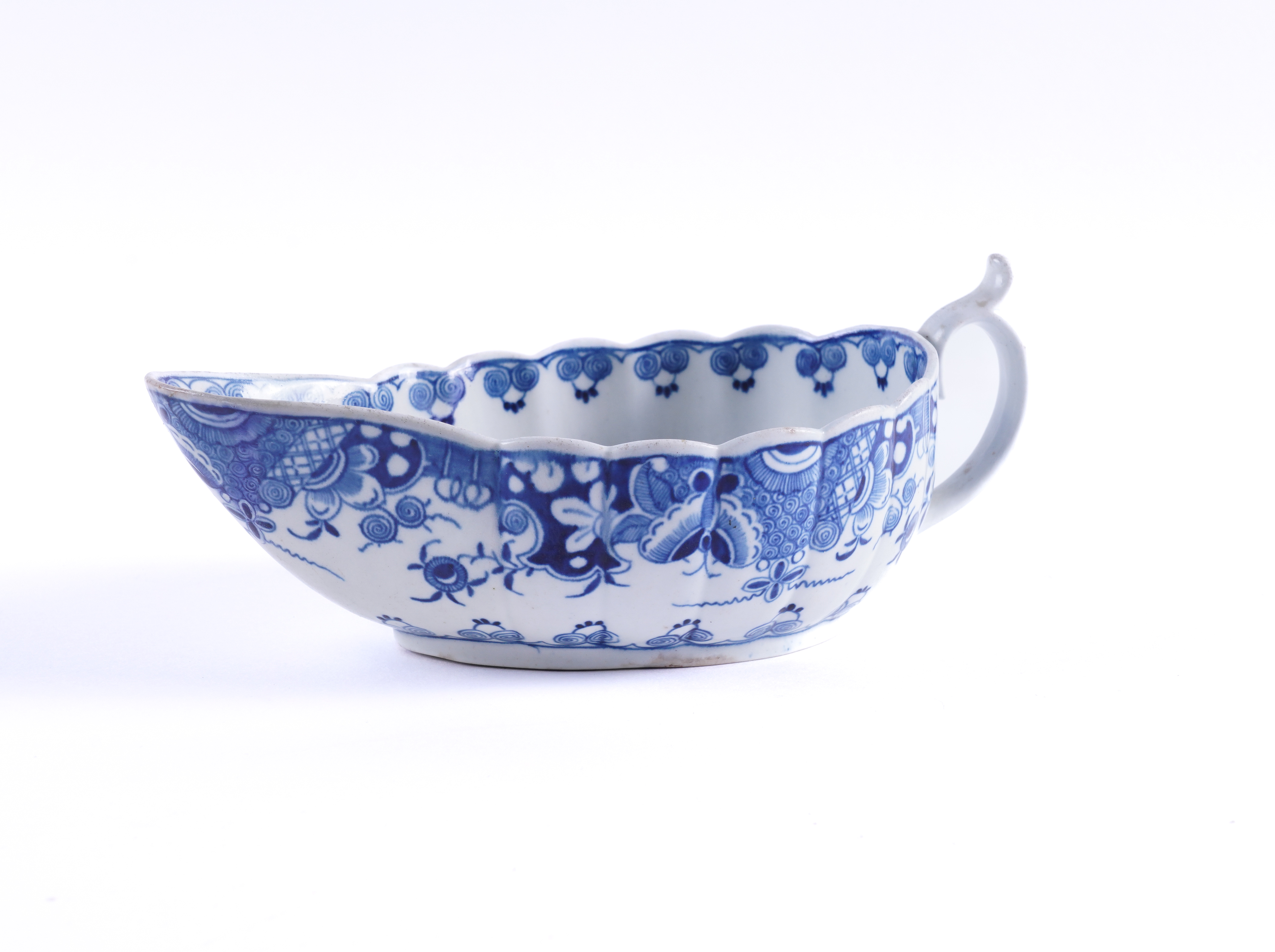 A WORCESTER BLUE AND WHITE OVAL FLUTED SAUCEBOAT