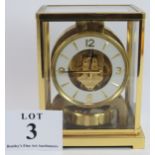 A Jaeger Le Coultre Atmos clock in glazed brass case, movement number 197426. Height 22cm. Condition