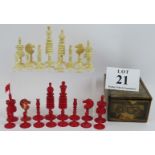 An antique turned ivory chess set with red and white pieces. Tallest piece 12cm. Condition report: