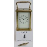 A good quality repeater carriage clock in glazed brass case, movement number 1591. Height 18cm.