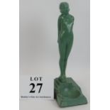 A period Art Deco cast lead figure of a nude holding apples behind her back. The five step base