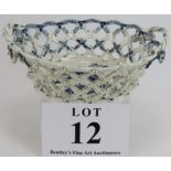 An 18th century English porcelain chestnut basket, probably Lowestoft, decorated with blue and white