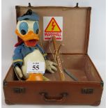 A large Donald Duck Pelham puppet in suitcase. Puppet 50cm tall. Condition report: Age related wear.