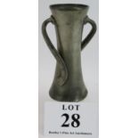 A Tudric pewter two handled vase, design No 030, by Oliver Baker for Liberty & Co. Height 18cm.