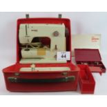 A vintage Bernina Minimatic sewing machines in case with manual, spools etc. Condition report: