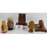 A wooden Cenotaph money box, a gavel and stand, a treen acorn shaped string dispenser, and two