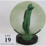 A period Art Deco lamp with nude figure backlit by a moon shaped glass. Height 26cm. Condition