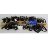 Ten various Nikon 35mm cameras and lenses including F60, FM, FE2, L35AW, FM2, N60, F401S, FE, EM,