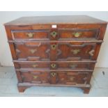 A 17th century Jacobean oak chest of four long shallow & deep drawers with geometric moulding &