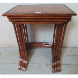 A fine Edwardian quartetto of rosewood and walnut nesting tables, inlaid and crossbanded and