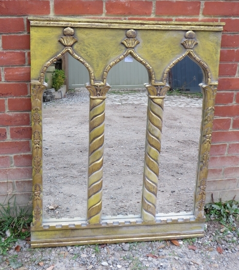 A contemporary giltwood framed triptych wall mirror in the Neo-classical taste, featuring carved