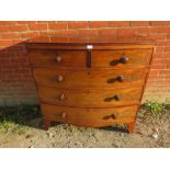 A Georgian flame mahogany bow front chest of two short over three long graduated cock beaded drawers