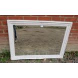 A bevelled rectangular wall mirror in an antique style moulded white frame. Condition report: No