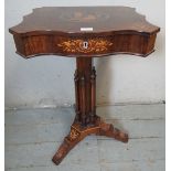 A 19th Century rosewood marquetry inlaid serpentine edged work table, the hinged top opening onto