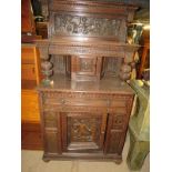 A basically 17th Century oak tri-dresser dated 1665, with detailed panels depicting horse drawn
