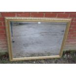 A large rectangular bevelled wall mirror in an ornate gilt gesso frame. Condition report: No issues.