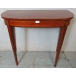 A good quality reproduction mahogany console table in the Regency taste, crossbanded & strung with