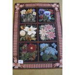 A late 20th Century needlework wall-hanging depicting 6 species of flowers. In very good condition