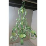 A large very decorative wrought iron 6 branch chandelier featuring repeating scrolls & foliate
