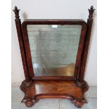 A large Victorian mahogany swing vanity mirror, with tapering octagonal uprights surmounted by
