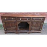 A 19th century oak sideboard/dresser base in a 17th century taste, housing three short drawers