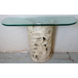 A Contemporary Italian console table with a carved and pierced stone plinth depicting floral and