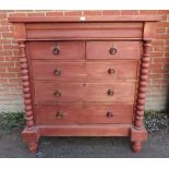 A 19th Century pine Scottish chest of two short over three long graduated drawers fitted with turned