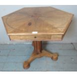 A 19th century rosewood octagonal centre table, strung with satinwood in a radial pattern and