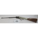 A vintage .22 air rifle (folding) with walnut stock. No certificate required.