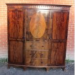 A good quality mahogany triple wardrobe/compactum by Waring & Gillow of Lancaster, featuring a