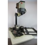 A Leitz Focomat V35 autofocus enlarger with black and white head, Durst timer, manual, R.R. Beard