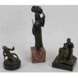 Three bronze figures in the style of Franz Bergmann, one being an Arab water carrier, one of a