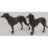 A pair of cast bronze Borzoi dogs, unsigned. Height 16.5cm. Length 26cm. Condition report: No