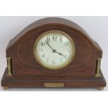 A small Edwardian mantel clock in mantel veneered case with boxwood stringing, gilt columns and feet