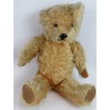 A cute vintage jointed Mohair teddy bear, height 40cm. Condition report: Gently loved. Back seam