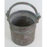 A rustic copper pail or bucket with cast brass handle. Diameter 22cm. Height 23cm + handle.