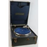 A fulltone vintage wind up gramophone in carry case. Condition report: Winds and turns. Handle is