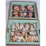A collection of antique Bisque porcelain doll's heads and parts, some restored. (qty). Condition