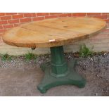 A vintage circular breakfast table, the medium oak deep grained top on an octagonal tapered pedestal