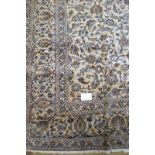 A fine Persian Kashan carpet heavily patterned (foliage) on a cream ground in good condition. 3.