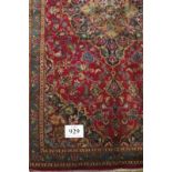 A Kashan rug. 180 x 105. Condition report: Good colour and condition.