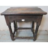 A 17th century oak single drawer side table of excellent colour, on turned and block supports united