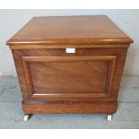 A Victorian mahogany commode with hinged top & original ceramic slop bucket, raised on ceramic
