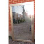 A very large contemporary rectangular bevelled wall mirror, in distressed copper effect frame.
