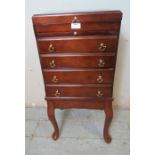 A reproduction mahogany collector's cabinet on stand with hinged lid & brushing slide over four