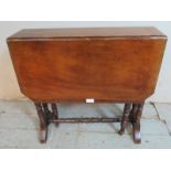 An Edwardian mahogany octagonal Sutherland table raised on ring turned supports with outsplayed