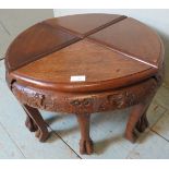 Four vintage Chinese hardwood nesting tables with carved frieze depicting dragons & figural