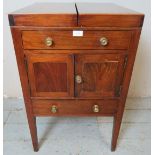 A George III mahogany gentleman?s washstand, strung with satinwood and ebony, the hinged lid opening