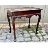 A 19th Century mahogany Irish silver table in an 18th Century style, with shell carved frieze,