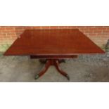 A William IV Cuban mahogany tilt top square breakfast table, with reeded edge, on a turned